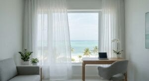 Morning light streaming through window overlooking calm turquoise Caribbean waters in Cozumel, Mexico, where Iboga Wellness Institute's medical clinic provides ibogaine treatment for depression