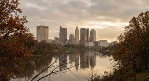 Dawn breaking over downtown Columbus skyline with Scioto River, representing hope and new beginnings for recovery