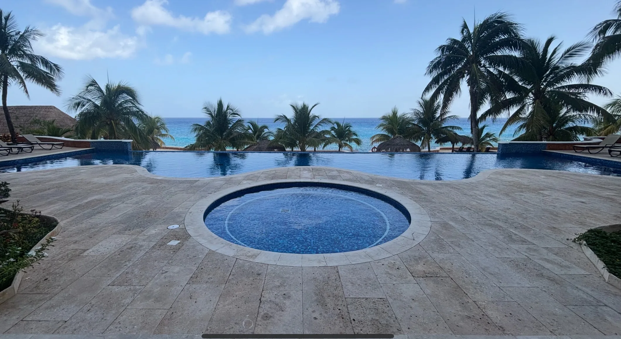 Pool and Caribbean ocean view at IWI Reserve in Cozumel